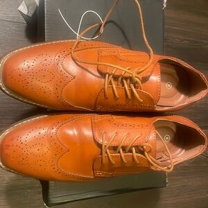 Brown hard bottom mens dress shoes